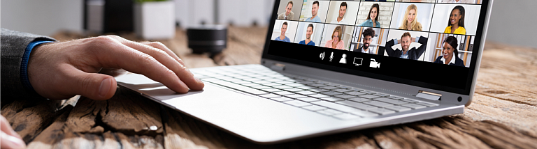 Image of person's hand on a laptop